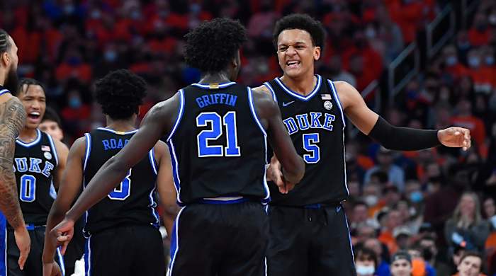 Duke forward Paolo Banchero (5) celebrates with forward AJ Griffin (21) after scoring against Syracuse during the first half of an NCAA college basketball game in Syracuse, N.Y., Saturday, Feb. 26, 2022.